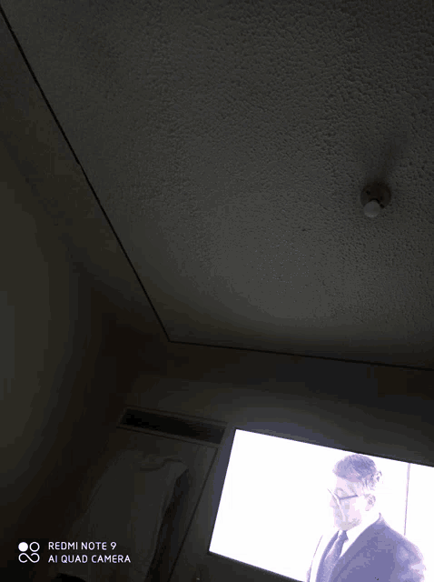 a redmi note 9 ai quad camera takes a picture of a tv screen