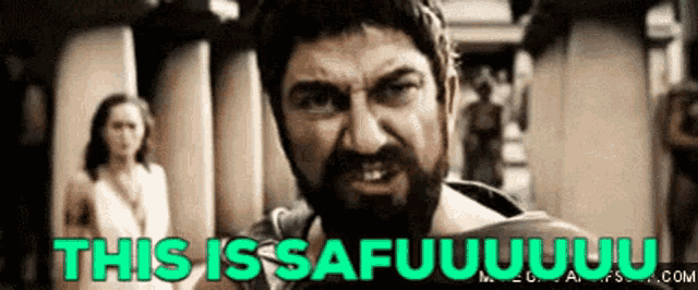 a man with a beard is standing in front of a woman and a sign that says `` this is safuuuuuuu '' .