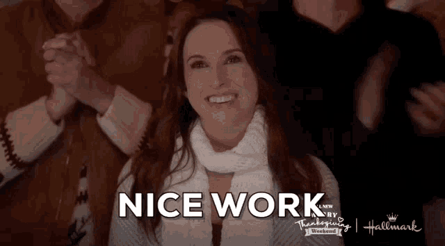 a woman is smiling in front of a group of people with the words nice work above her