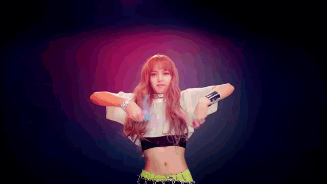 a woman with her arms outstretched is surrounded by colorful powder