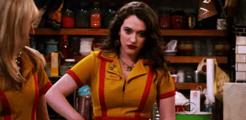 a woman in a yellow and red uniform has the name max on her shirt
