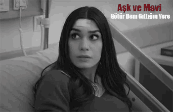 a woman is laying in a hospital bed with a bandage on her forehead .