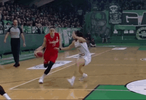 a basketball player wearing number 11 dribbles the ball