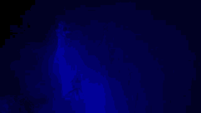 a blue light is shining on a ghost in a dark room