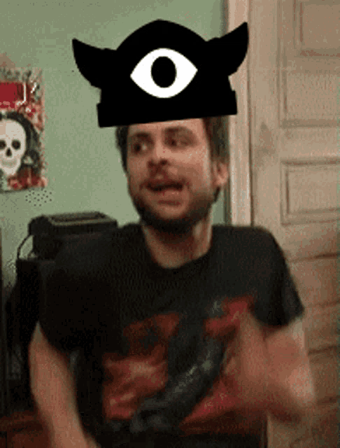 a man wearing a pirate hat with an eye and horns