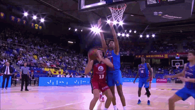 a basketball game is being played in a stadium with a p.r. meditrell banner