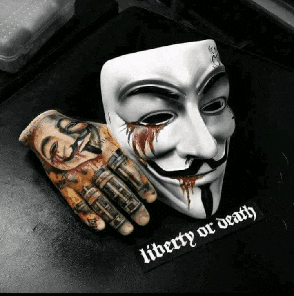 a tattooed hand next to a mask that says liberty or death on it
