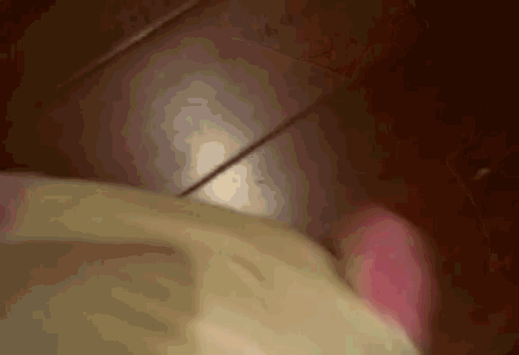 a close up of a person 's foot on a tiled floor .