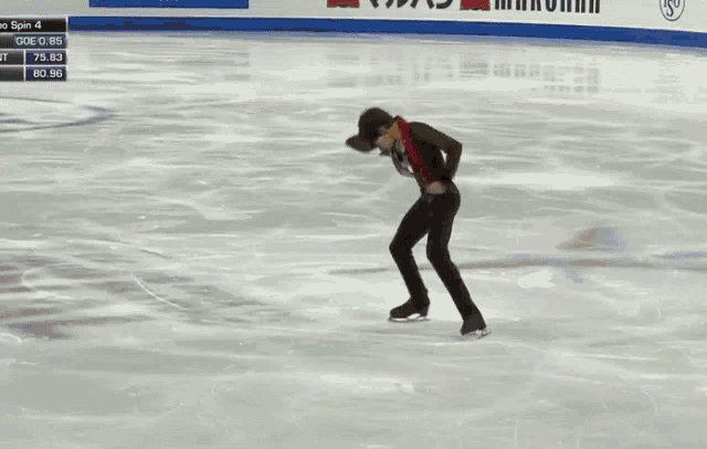 a young man is making a funny face in front of a sign that says ' ice spin 4 '