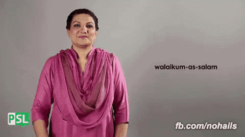 a woman in a pink shirt says waldikum as salam