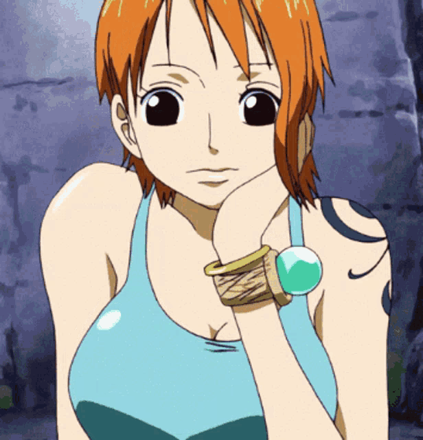 a girl with a tattoo on her shoulder is wearing a bracelet on her wrist