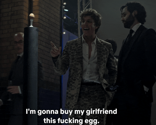 a man in a suit says " i 'm gonna buy my girlfriend this fucking egg .. "