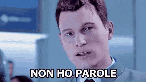 a man in a suit and tie is making a funny face and says non ho parole .
