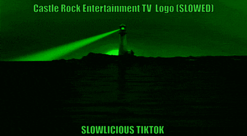 a castle rock entertainment logo with a lighthouse in the background