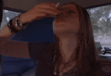 a woman with a ring on her finger is covering her face with her hand