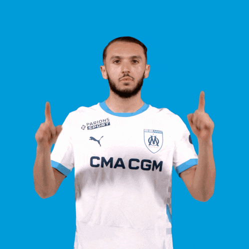 a man wearing a white shirt with cma cgm on the front