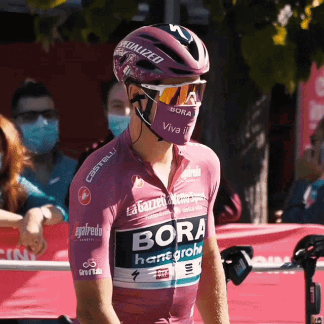 a man wearing a helmet and a jersey that says bora on it