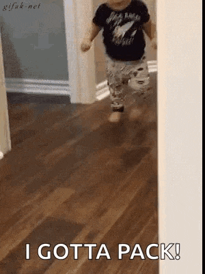 a baby is running down a hallway with the words `` i gotta pack '' behind him .