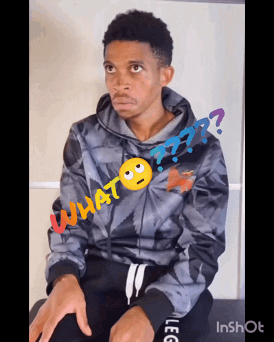 a man wearing a hoodie with the word what written on it