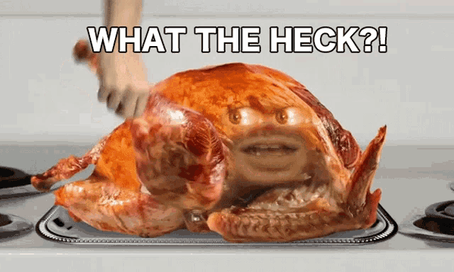 a roasted turkey with a face on it and the words what the heck above it