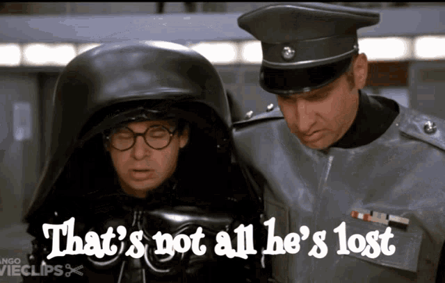 a man in a black helmet stands next to another man with the words that 's not all he 's lost above them
