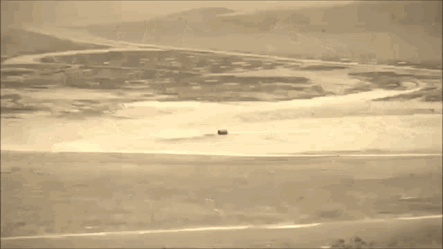 a large explosion is taking place in the middle of a field