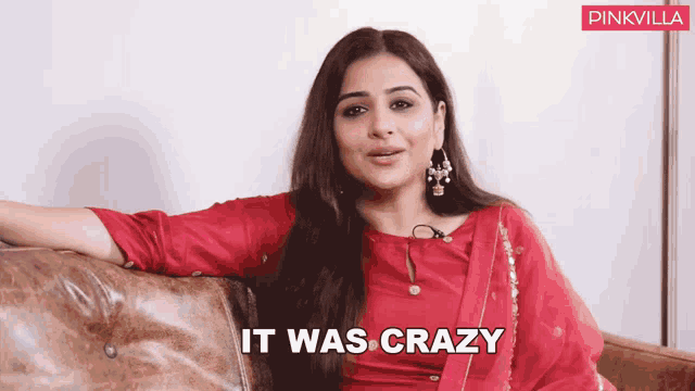 a woman sitting on a couch with the words " it was crazy " behind her