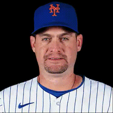 a man wearing a new york mets baseball uniform