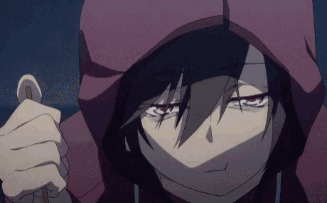 a close up of a person wearing a red hoodie holding a sword .