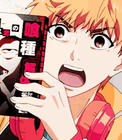 a boy covering his face with a book with chinese writing
