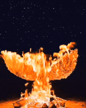 a large fire is burning in the night sky