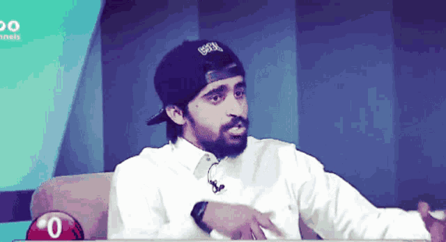 a man with a beard wearing a baseball cap that says ' gsd ' on it