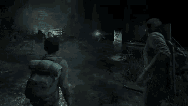 a person is holding a flashlight in a dark room