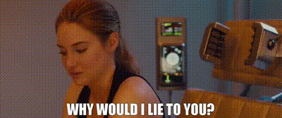 a woman is sitting in front of a machine with the words `` why would i lie to you '' written on it .