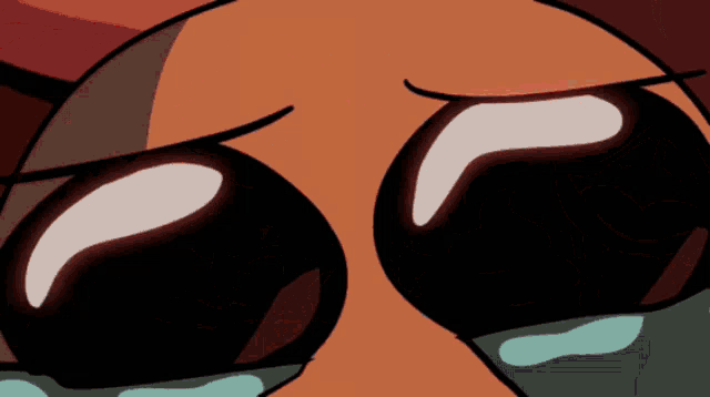 a close up of a cartoon character 's face with tears coming out of it