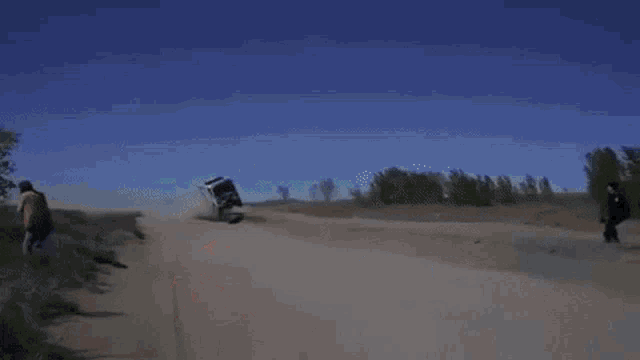 a man is driving a vehicle with a 7 hd sign on the side