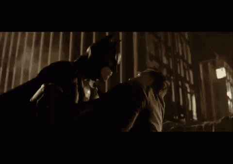 a close up of a man in a batman mask