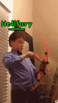 a boy in a blue shirt is playing with a toy bow and arrow with the name hellfury written above him