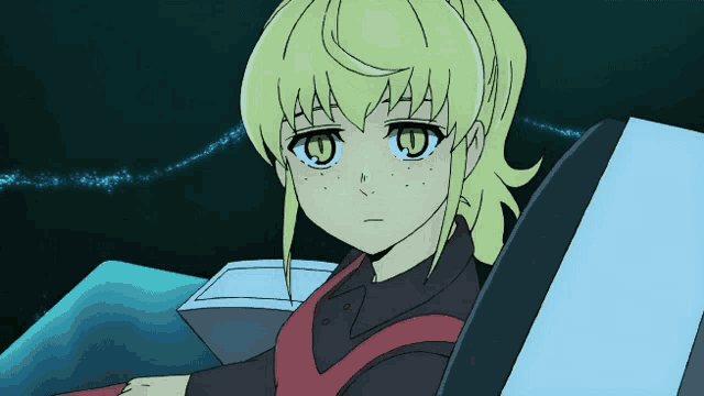 a girl with yellow hair and green eyes is sitting in a chair