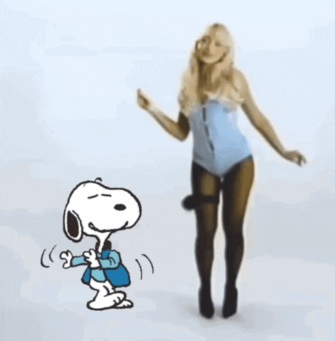 snoopy is dancing next to a woman in a blue leotard