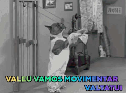 a black and white photo of a dog holding a newspaper with the words " valeu vamos movimentar valtatui " written above it