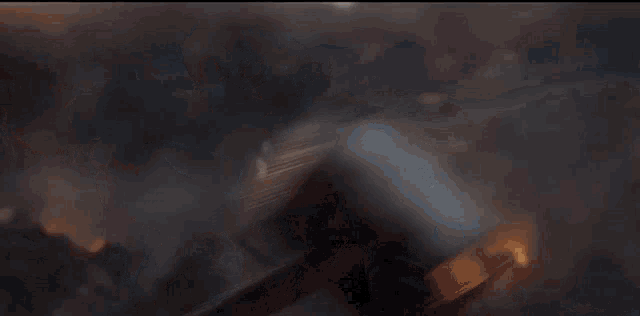 thor 's hammer is flying through the air in a blurry photo .