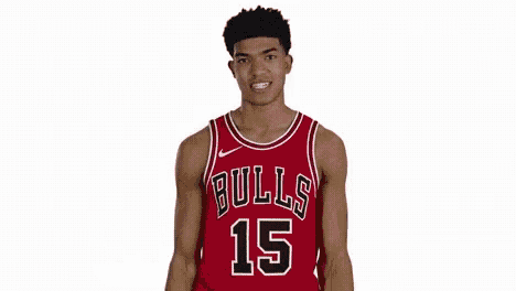 a man in a red bulls jersey is flexing his muscles