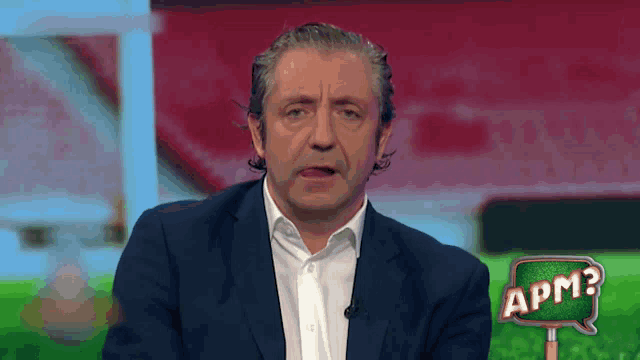 a man in a suit and white shirt with a speech bubble that says apm on it