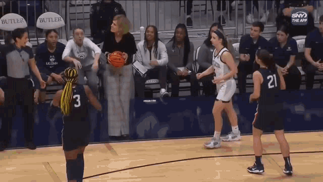 a women 's basketball game is being played at butler