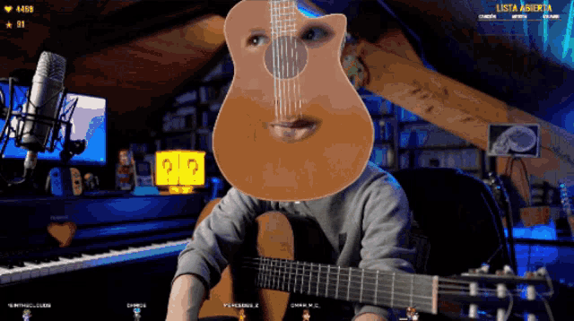 a man playing a guitar in front of a microphone and a sign that says lista abierta on it