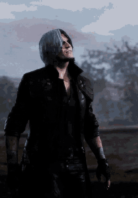a man with blue hair is wearing a black leather jacket