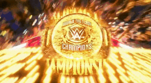 a world tag team champions logo is surrounded by flames and a crowd .