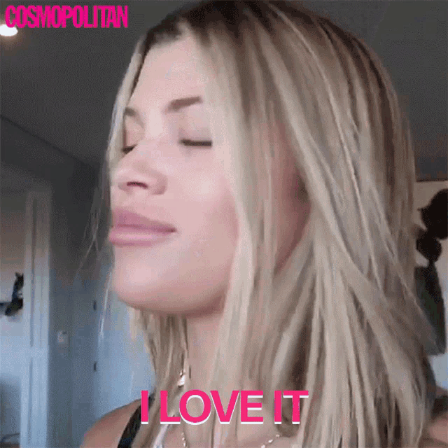 a close up of a woman 's face with the words i love it above her