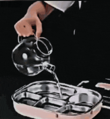 a person is pouring water into a stainless steel tray
